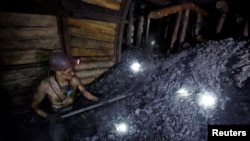 FILE - A miner works inside the Lutugin coal mine in Chystiakove (Torez) in the Donetsk region, Russian-controlled Ukraine, Aug. 9, 2023. 