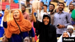 Fans react during Sudan's first women's league soccer match at the Khartoum stadium, Khartoum, Sudan, Sept. 30, 2019.