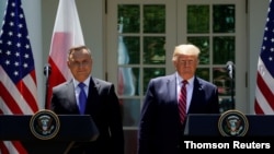 U.S. President Donald Trump and Poland's President Andrzej Duda attend a joint news conference in Washington in June 2019.
