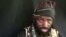 FILE - This screen grab image taken on Sep. 25, 2016, from a video released on Youtube by Boko Haram shows the Islamist group's leader Abubakar Shekau making a statement at an undisclosed location. 