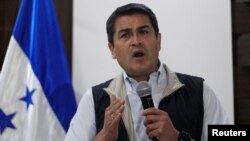 Honduras President and National Party candidate Juan Orlando Hernandez gestures as he addresses the media in Tegucigalpa, Honduras, Dec. 4, 2017. 