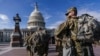 FILE - National Guard troops reinforce security around the U.S. Capitol ahead of expected protests leading up to Joe Biden's inauguration as president, in Washington, Jan. 17, 2021.