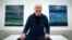 Artist Sean Scully poses with his works "Landline Bruke 5.14" (L) and "Landline Blue Blue" at the Timothy Taylor Gallery in London, Nov. 20, 2014. 