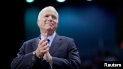 FILE - U.S. Republican presidential nominee Senator John McCain of Arizona listens as he is introduced at a campaign rally in Fayetteville, N.C., Oct. 28, 2008. 