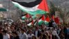 Israeli Arab demonstrators take part in a Land Day rally in the northern village of Araba, March 30, 2014. 