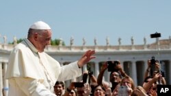 FILE - Pope Francis leaves after his weekly general audience, at the Vatican, Wednesday, Aug. 29, 2018. (AP Photo/Andrew Medichini)