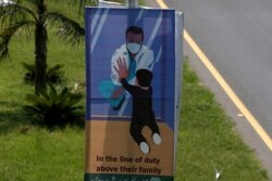 A banner paying tribute to doctors who are offering care and saving lives during the coronavirus pandemic is displayed on a highway in Islamabad, Pakistan, July 13, 2020.