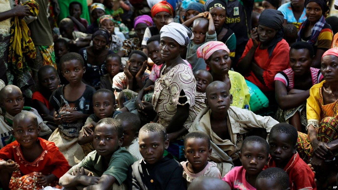 FILE - Refugees who fled Burundi's violence and political tension wait to board a U.N. ship, at Kagunga on Lake Tanganyika, Tanzania, to be taken to the port city of Kigoma, May 23, 2015.