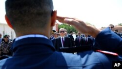 Turkey President Recep Tayyip Erdogan, rear center, reviews special forces personnel at their headquarters in Ankara, Turkey, July 29, 2016.