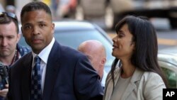 FILE - Former Illinois Rep. Jesse Jackson Jr. and his wife, Sandra, arrive at federal court in Washington.