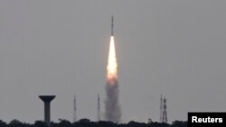 FILE - India's Polar Satellite Launch Vehicle (PSLV-C23), carrying five satellites, lifts off from the Satish Dhawan Space Centre in Sriharikota, north of the southern Indian city of Chennai, June 30, 2014.