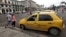 A taxi driver awaits customers in Havana, Cuba, Jan. 8, 2014. 
