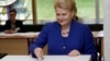 Lithuania's President Dalia Grybauskaite casts her vote during European Parliament and Lithuania's presidential elections in Vilnius, May 25, 2014. 