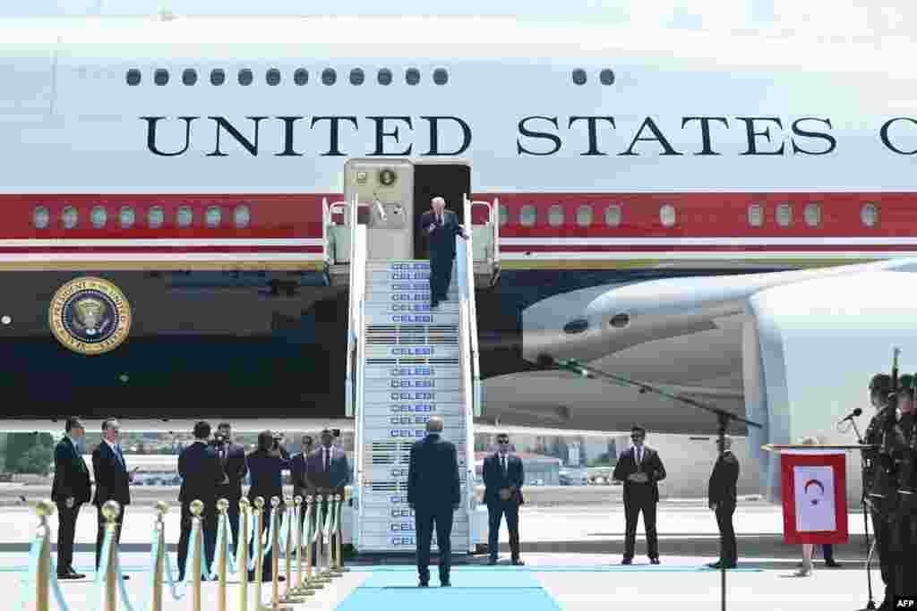Turkish President Recep Tayyip Erdogan (C, bottom) welcomes US President Donald Trump (up) upon his arrival on Air Force One at Etimesgut Air Base near Ankara, on July 7, 2026, as he travels to attend the 36th NATO Heads of State and Government Summit.
