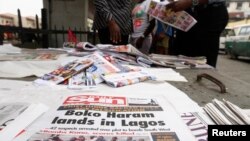 Newspapers are displayed at a vendor's stand along a road in Obalende district in Nigeria's commercial capital Lagos, July 30, 2013.