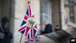 The British Union flag flies from the front of a car as British ambassador to Russia, Laurie Bristow attends a meeting at the Russian foreign ministry building in Moscow, Russia, March 17, 2018. 