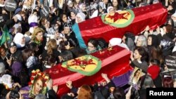 Funeral of three Kurdish activists shot in Paris, Diyarbakir, Turkey, Jan. 17, 2013.