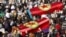People carry the coffins of the Kurdish activists, who were shot in Paris, during a funeral ceremony in Diyarbakir, the largest city in Turkey's mainly Kurdish southeast, January 17, 2013. The bodies of the three activists, including that of Kurdistan Wor