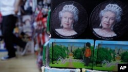 A souvenir shop selling memorabilia with pictures of Queen Elizbeth II, in Windsor, England April 21, 2021, who is marking her 95th birthday in a low-key fashion at Windsor Castle, just days after the funeral of her husband Prince Philip.