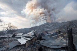 FILE - A burned structure in Yucaipa, Calif., Sept. 5, 2020. A couple’s plan to reveal their baby’s gender at a party went up in smoke in Yucaipa when a pyrotechnical device they used sparked a wildfire that has burned thousands of acres.