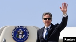 U.S. Secretary of State Antony Blinken waves as he boards his plane departing New Delhi for Washington, D.C., March 3, 2023.