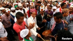 FILE - Muslim men sing after attending Eid al-Fitr prayers to mark the end of the holy fasting month of Ramadan in Addis Ababa, Ethiopia, July 6, 2016. 