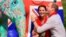 Britain's Prince William decorates an Elephant Parade statue as his wife Catherine, the Duchess of Cambridge, laughs during a visit to the Mark Shand Foundation at Kaziranga in the northeastern state of Assam, India, April 13, 2016.