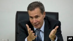 FILE - Alberto Nisman, the prosecutor investigating the 1994 bombing of the Argentine-Israeli Mutual Association community center, talks to journalists in Buenos Aires, Argentina, May 29, 2013.