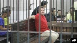 Suspected Russian arms dealer Viktor Bout sits in a holding cell on 8 March 2008, following an appearance at Criminal Court in Bangkok, Thailand.