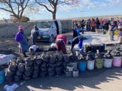 Some informal traders in Harare say, July 27, 2020, poverty forces them continue to defy authorities’ plea to stay home or observe social distance.(Columbus Mavhunga/VOA)