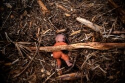 A doll is seen amid rubble in the aftermath of Hurricane Dorian in Freetown, Grand Bahama, Bahamas, Sept. 13, 2019.