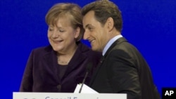 German Chancellor Angela Merkel and French President Nicolas Sarkozy in a joint news conference in Brussels, February 04, 2011