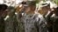 Gen. John Allen, center, the top U.S. commander in Afghanistan, salutes before he observes Memorial Day, May 28, 2012.