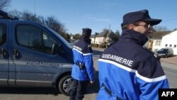 FILE - A French gendarme in Calvados wearing a blue Gore-Tex jacket, Feb. 28, 2005. Robert W. Gore, inventor the breathable-yet-waterproof fabric known as Gore-Tex has died, Sept. 17, 2020.