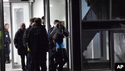 A man is arrested by the police at a hospital in Berlin, Germany, Nov. 19, 2019. 