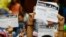 Protesters opposing Egyptian President Mohamed Morsi hold up documents from the "Tamarud" campaign during a news conference at their headquarters in Cairo, May 29, 2013. 