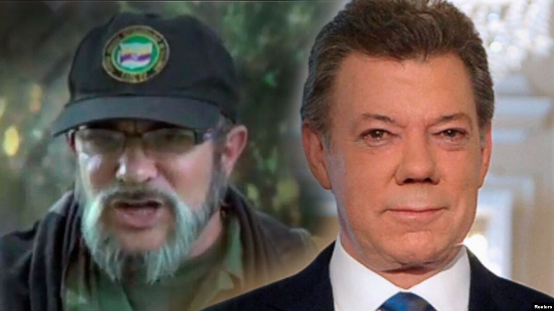 Presiden Kolombia Juan Manuel Santos (kanan) dan pemimpin pemberontak FARC yang dikenal sebagai Timoshenko.