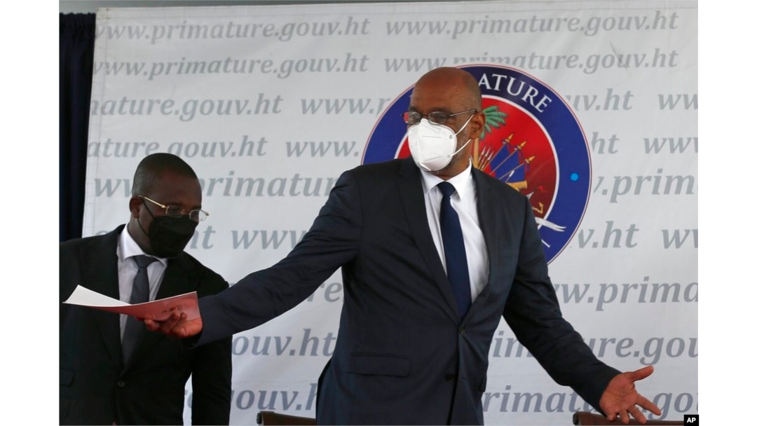 FILE - Haiti's designated Prime Minister Ariel Henry gestures during his appointment ceremony in Port-au-Prince, Haiti, July 20, 2021, weeks after the assassination of President Jovenel Moise on July 7 at his home.