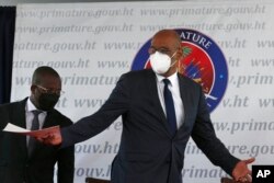 FILE - Haiti's designated Prime Minister Ariel Henry gestures during his appointment ceremony in Port-au-Prince, Haiti, July 20, 2021, weeks after the assassination of President Jovenel Moise on July 7 at his home.