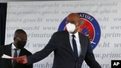 FILE - Haiti's designated Prime Minister Ariel Henry gestures during his appointment ceremony in Port-au-Prince, Haiti, July 20, 2021, weeks after the assassination of President Jovenel Moise on July 7 at his home.