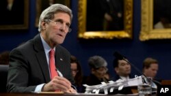 FILE - Secretary of State John Kerry testifies on Capitol Hill in Washington.