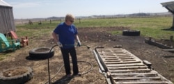 Joyce Rydstrom of Alta, Iowa, had to shut the doors to her hair salon in March amid the coronavirus pandemic. These days, she spends some of her free time gardening.