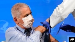 Dr. Anthony Fauci, director of the National Institute of Allergy and Infectious Diseases, prepares to receive his first dose of the COVID-19 vaccine at the National Institutes of Health, in Bethesda, Md., Dec. 22, 2020.