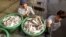 Burmese workers load fish onto a bus in Samut Sakhon Province, 40 kilometers (25 miles) west of Bangkok, Thailand. (file photo)