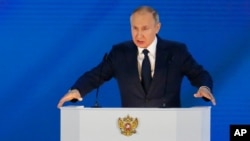 Russian President Vladimir Putin gives his annual state of the nation address in Manezh, Moscow, April 21, 2021.