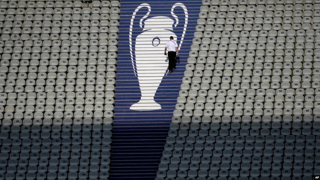 FILE - A security official walks past a Champions League trophy logo during an Inter Milan training session at the Ataturk Olympic Stadium in Istanbul, Turkey, June 9, 2023.