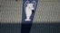 FILE - A security official walks past a Champions League trophy logo during an Inter Milan training session at the Ataturk Olympic Stadium in Istanbul, Turkey, June 9, 2023.