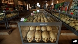 FILE - Skulls of victims of the 1194 genocide are kept inside the Catholic church in Ntarama, Rwanda, April 5, 2019.