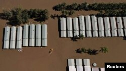 Flooding is seen at the Hawkesbury River northwest of Sydney in Wisemans Ferry, Australia. More than 40,000 residents have been forced to flee their homes as torrential rain sparked dangerous flash floods in Sydney&#39;s western regions.