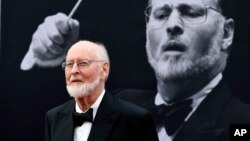 FILE - Composer John Williams poses on the red carpet at the 2016 AFI Life Achievement Award Gala Tribute to John Williams at the Dolby Theatre in Los Angeles, June 9, 2016.